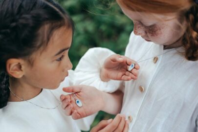 Two Young Friends Looking at Necklaces